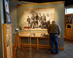 A display of photography in the camp with a large photo of the Heart Mountain Camera Club.