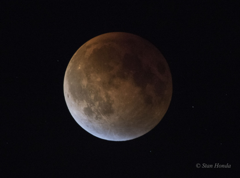 Total Lunar Eclipse, Sept 27, just before the moon recedes from Earth's shadow. Blue light seen on the edge of the moon is sunlight refracted through ozone high in the Earth's atmosphere.