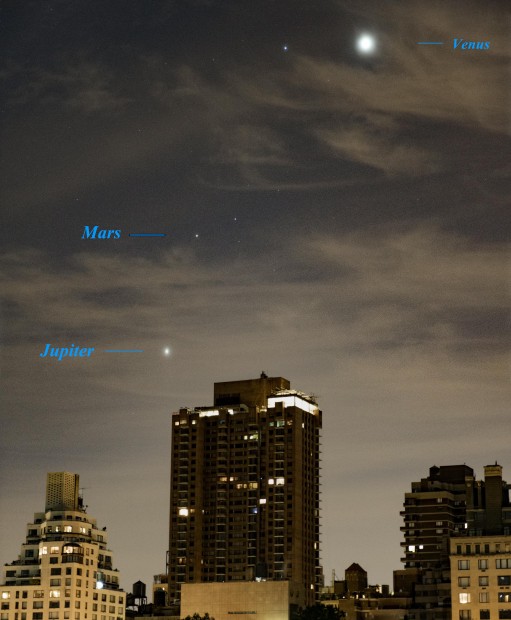 Oct. 7, 2015: Three planets shine through thin clouds over Fifth Avenue buildings.